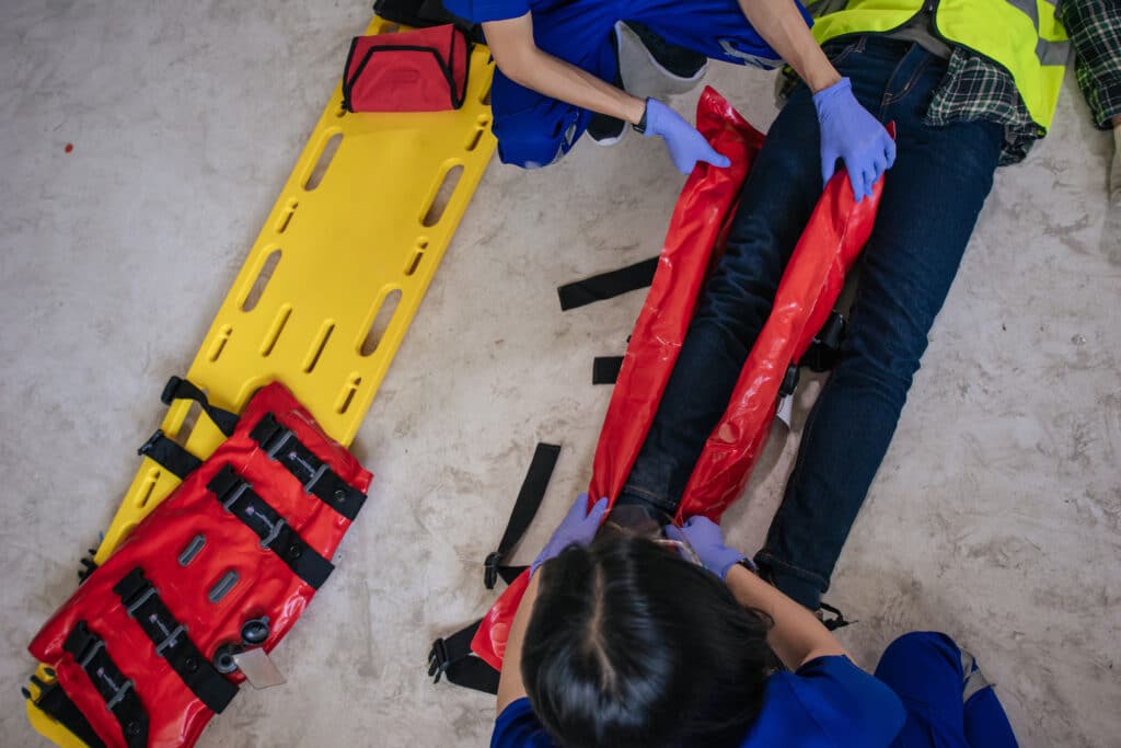 EMT applying splint during emergency response